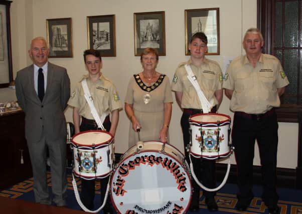Conductor Stephen Wharry, Chairman Hugh Hunter along with drummers James Galbraith, Adam Alderdice and Mayor Audrey Wales. Submitted image.