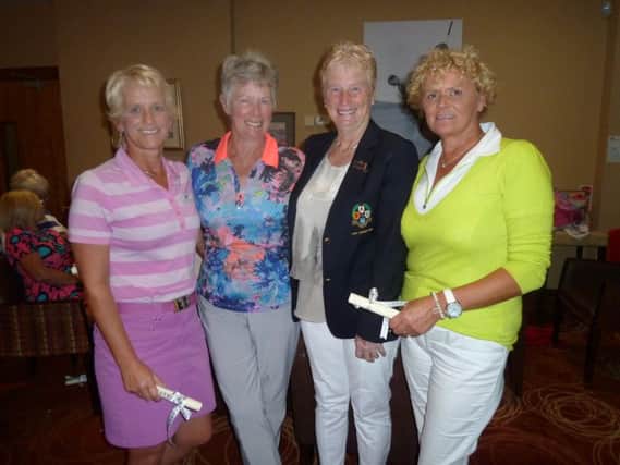 Winners of Good Cause Day at Portstewart Golf Club Ann Barr, Terry McCullough and Moraig McCrum pictured receiving their prizes from Lady Captain, Irene Murray.