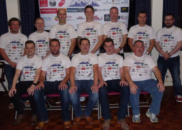Barry Williamson, his brothers, cousin and team mates who will climb the four peaks, along with drivers and support crew.  All are wearing their special T-shirts which have the logos of all their major sponsors. INPT38-021