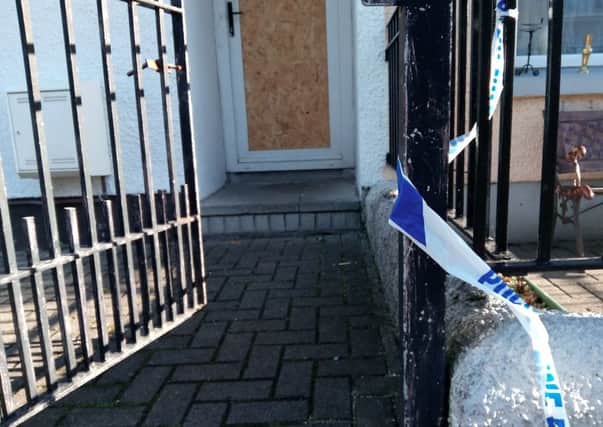 Police tape at the entrance to the boarded up Fleet Street house which was attacked on Wednesday morning. INLT-39-703-con