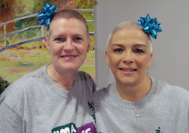 After: Janet Hunter (left) and Tina McCready braved the shave for Macmillan Cancer Support.