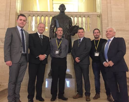 Christopher and Ryan Sherrard at Parliament Buildings with Gary Middleton MLA, William Humphrey MLA, Cllr David Ramsey and George Robinson MLA .