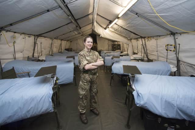 Pictured:Corporal Caroline Swanson inside the ward. 

British Army medics built a huge field hospital on an airfield at Dishforth, North Yorkshire.

The 52-bed tented field hospital is being staffed by 34 Field Hospital, 204 (North Irish) Field Hospital and 243 (Wessex) Field Hospital.

The field hospital contains four Emergency Bays, two Operating Tables, four Intensive Treatment Unit (ITU) beds and 48 General Ward beds.