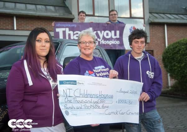 Stacey Chambers presenting cheque to Childrens Hospice Community Fundraising Officer Catherine OHara with members of the Carrick Car Cruise Team. Submitted image.