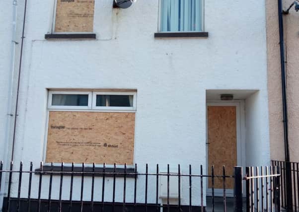 The boarded up Fleet Street home which was damaged by men wielding hatchets on Wednesday September 21. INLT-39-702-con