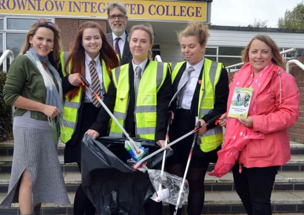 Brownlow Integrated College are taking part in an ABC Council sponsored anti-litter programme, the 'Adopt-A-Street Scheme' where local schools and residents take responsibility for clearing litter from their chosen street or area. Pictured at the school's launch of the scheme are from left, Mrs Ruth Morton, extended schools co-ordinator, Justina Delgyte, Mr Stephen Creber, school principal, Marlena Latka, Maja Ochojska and Pamela Hanna, ABC Council community engagement officer. INLM40-204.