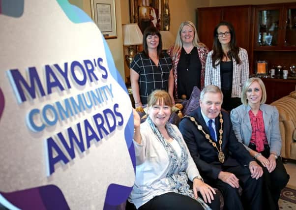 Helping the Mayor, Councillor Brian Bloomfield MBE launch the Mayor's Community Awards 2017 are (back row, l-r)   Lindsay Armstrong, Volunteer Now; Rhonda Frew, Lisburn & Castlereagh City Council and Caroline McGrath, South Eastern Health & Social Care Trust.  Front Row ( l-r)  are   Monica Meehan, Education Authority and Cathy Adamson, Lisburn & Castlereagh City Council.