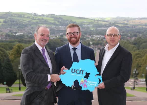 Pictured with the Economy Minister, Simon Hamilton, are Harry McDaid, CEO of UCIT and Nigel McKinney, BCTs Director of Operations
