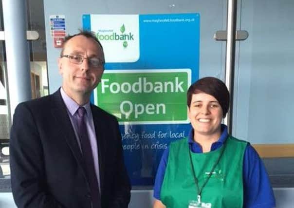 Mid Ulster DUP MLA Keith Buchanan with a volunteer at magherafelt Foodbank