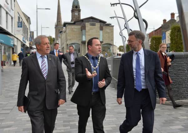 Cllr Uel Mackin (left) and Chamber President Stephen Houston show Lord Dunlop (right) around Lisburn city centre. Pic by Aaron McCracken, Harrisons