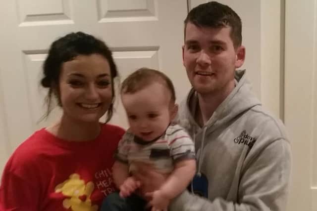 Kathryn and Luke with their son Charlie. INPT42-020