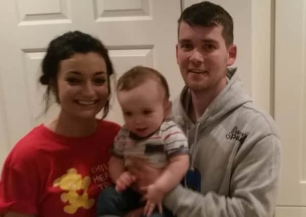 Kathryn and Luke with their son Charlie. INPT42-020
