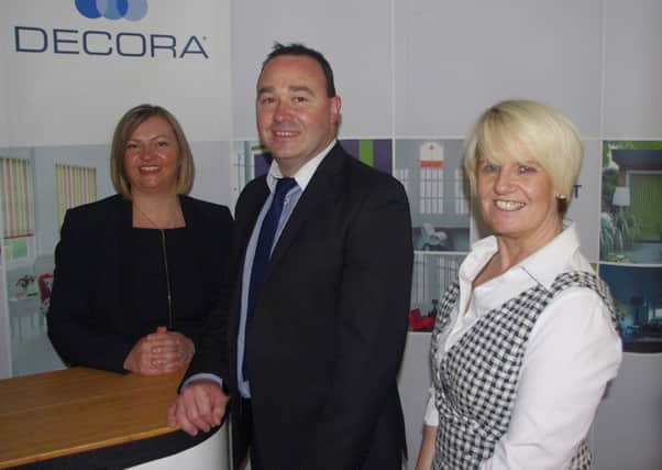 Decora HR Manager Gillian Corstorphine with Chamber President Stephen Houston and Customer Services Manager Pat McIlveen.