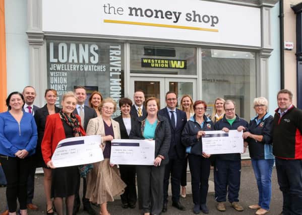 Wanda McIlwaine of Shop Mobility Lisburn, Ita McNally and Deirdre McAllister from Community Circus Lisburn, and John Kivlahan, Margaret Killough, Lorraine Foster and Andrew Welsh of the Lisburn 2Gether Special Olympics Club, accept cheques from staff at The Money Shop, Market Place, Lisburn.

Picture: Philip Magowan / PressEye