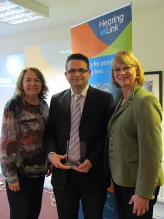 Heather Jackson Award winner James Newell with Dr Lorraine Gailey, CEO of Hearing Link, and Bernie Kelly, Service Manager, BHSCT Physical and Sensory Disability Team.