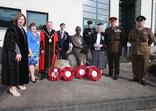 Pictured at the recent wreath laying ceremony at Lagan Valley Island are (l-r) Dr Theresa Donaldson, Chief Executive; the Mayoress, Rosalind Bloomfield; the Mayor, Councillor Brian Bloomfield MBE; Mr J Lyons, National Malaya and Borneo Association; Capt Fynn Vorges, 2 Rifles; Lord Lieutenant of County Antrim, Mrs Joan Christie OBE; Lt Col Frank Cannon CO NIGSU and Major Gavin Maguire, 253 Medical Regiment.