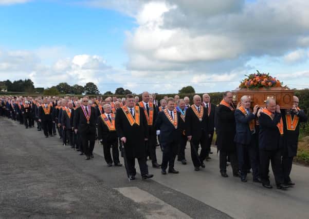 The funeral of Orange Order Grand Secretary Drew Nelson makes its way to St John's Church near, Hillsborough, Co Down