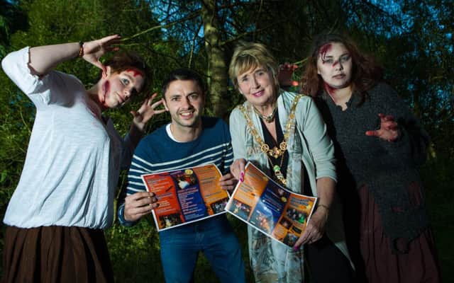 The Mayor of Causeway Coast and Glens Borough Council, Alderman Maura Hickey, and Gareth Witherow from sponsors, The Tides in Portrush, get in to the spirit of Halloween with the help of some spooky characters.