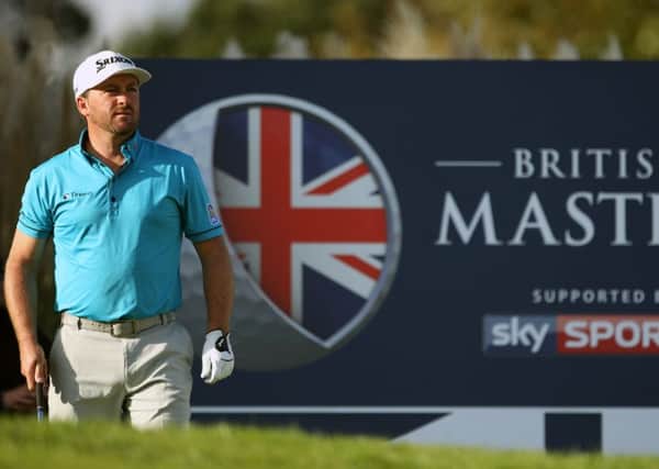 Northern Ireland's Graeme McDowell watches his tee shot off the 17th hole