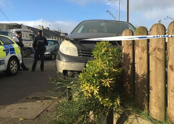 Car crashed into Cookstown garden. A pensioner out walking was injured