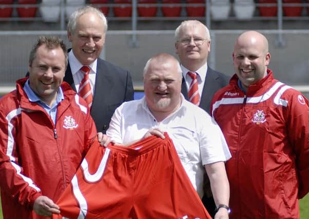 Annesley Renshaw,centre, Wade Training, during the launch of shorts sponsorship at Shamrock Park. Included is Bill Emerson.  secretary of Portadown FC.
