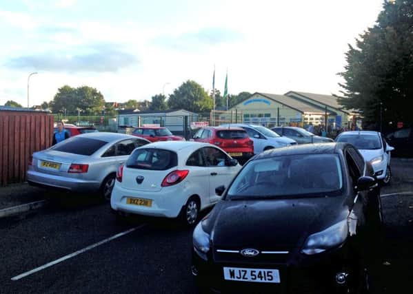 Traffic outside Portadown Integrated Primary School. MH
