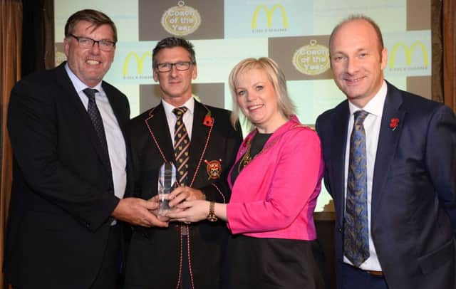 Winner of the 2015 Coach of the Year Award is Geoff Bones presented by Mayor of Causeway Coast and Glens Borough Council, Councillor Michelle Knight McQuillan, with compere for the evening Stephen Watson,  and sponsored by Bruce Bailie of McDonalds Coleraine.