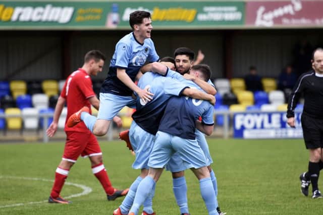 Institute's Gareth Brown is mobbed by his team mates after his goal against Annagh on Saturday. INLS4316-103KM
