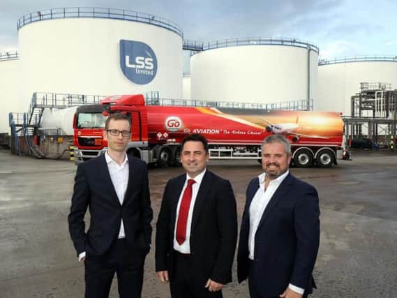 Danske Banks Ciaran McLaughlin with LCC Director Dan Loughran and Michael O Loughran at the companys oil terminal at Foyle Port, Lisahally