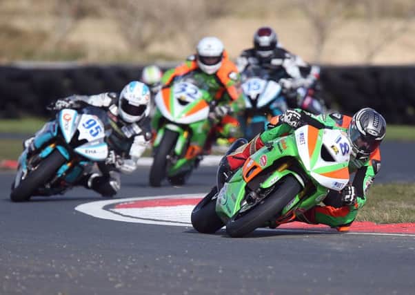 Andrew Irwin (Gearlink Kawasaki) leads the opening Supersport race from David Allingham (EHA Yamaha) and Carl Phillips (Gearlink Kawasaki) at Bishopscourt in Co Down on Saturday.