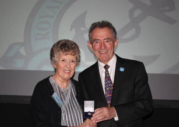 Lilian Stewart receives her award from RNLI Chairman Charles Hunter-Pease. (Submitted image)