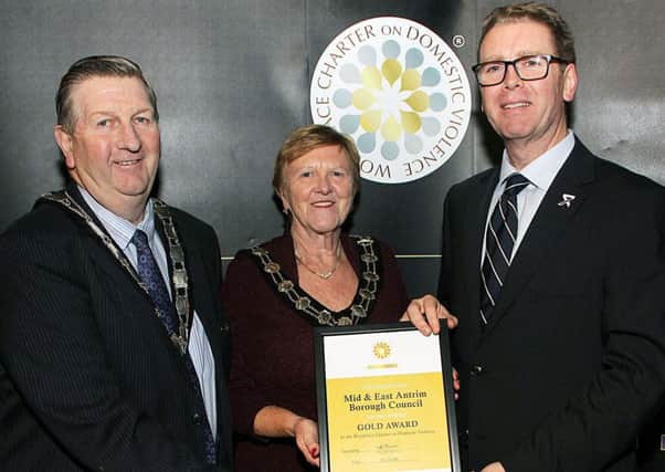 PSNI Assistant Chief Constable Will Kerr pictured presenting the Gold Award to the Deputy Mayor, Alderman William McNeilly and Mayor, Councillor Audrey Wales MBE