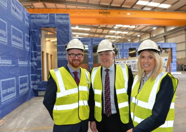 Pictured at the McAvoy Group Lisburn offices are: Economy Minister Simon Hamilton MLA with Orla Corr OBE, Executive Chairperson and Eugene Lynch, Managing Director of the McAvoy Group.