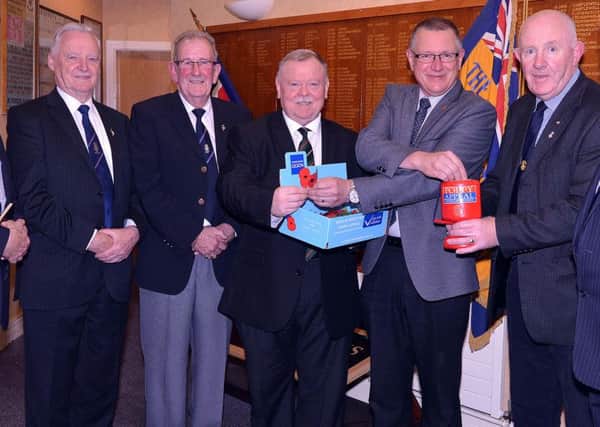 Pictured at the launch of the 2016 Portadown Royal British Legion Poppy Appeal are from left, Charles McCartney, branch chaplain, Sam Thompson, treasurer, Stewart Buckley, chairman, Alderman Robert Smith who bought the first poppy, Alan Burns, club member, and Philip  Morrison, branch president. INPT43-204.