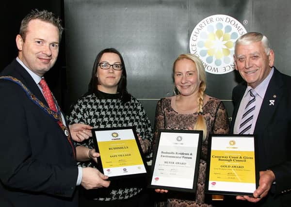 Causeway Coast and Glens Borough Council Deputy Mayor James McCorkell, Leanne Abernethy, PCSP Deputy Chair, Melissa Lemon, PCSP Officer and Alderman William King, PCSP Chair with the awards received by Causeway Coast and Glens Borough Council and Bushmills