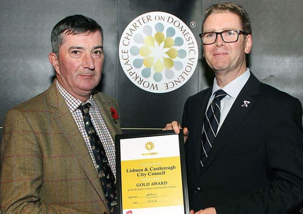 Councillor James Baird, Chairman of the Council's Environmental Services Committee is pictured receiving the Council's Gold Charter from Will Kerr, Assistant Chief Constable PSNI.