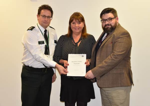 Chief Supt Chris Noble, Christine McCullough, Vice Chairman of Lisburn & Castlereagh PCSP, and Aodhan Connolly, Director of the Northern Ireland Retail Consortium.