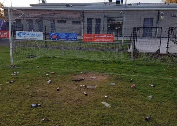 Debris on the pitch at Mossley Pavilion. INNT 45-817CON