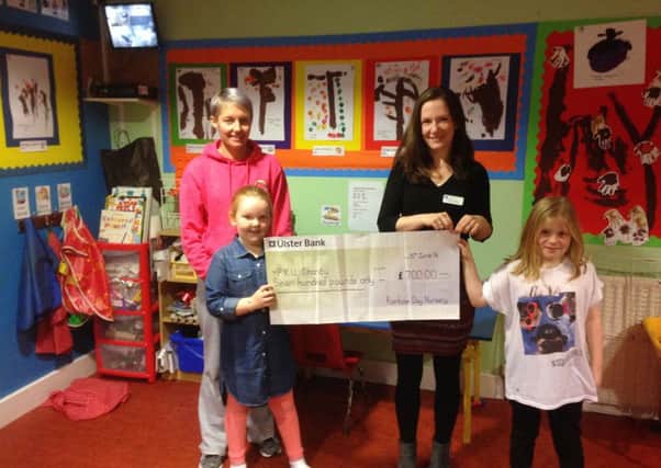 L-R Catharine Maybin is pictured presenting a cheque for Â£700 to the Royal Hospitals Clinical Psychologist Katie Banks in aid of The National Society for Phenylketonuria charity at the Belfast Royal Hopsitals.
The money was raised through a PJ day at Larne's Rainbow Day Care Nursery.
Also included in the photo are Katie Agnew and Sophia Manning. INLT-46-703-con