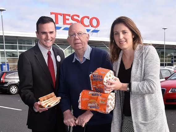 From left, at Tesco Cookstown is Aaron ONeill from Tesco NI, competition winner Norman Bell and Colette Wilson from Irwins Bakery