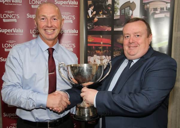 The 'Radio Foyle Player of the Year' award is presented to Decker Curry of Ardmore by Radio Foyle's Dessie McCallion at the North West Cricket Awards in the White Horse Hotel.