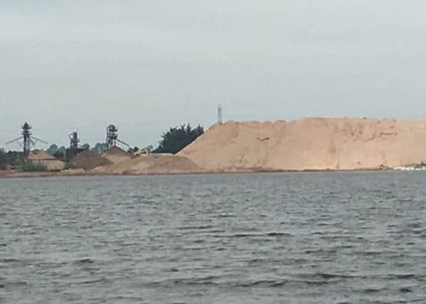 Mountains of sand pictured on shore of Lough Neagh