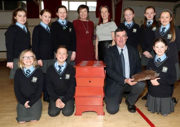 Councillor James Baird, Chairman of the Council's Environmental Services Committee is pictured with the Wormery that was won by St Joseph's Primary School, Lisburn along with members of the school's Eco-Committee; Mrs Fleming, Acting Principal and Mrs Nuala O'Hare,The World Around Us Co-ordinator.
