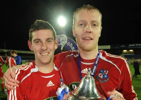 Dean Smith (left) - pictured with Darragh Peden following a Loughgall trophy triumph in his playing days - is back at Lakeview Park as interim manager. Pic by Pacemaker.