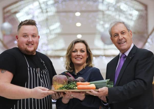Chef Gerard Magill, Meet & Thyme, Hillsborough, Joanne McErlain, Treat Week organiser and Councillor Uel Mackin, Chairman of the council's Development Committee, show off some of the outstanding local ingredients used in preparing seasonal dishes during Lisburn & Castlereagh's Treat Week.