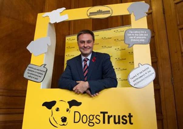 Dogs Trust officials discussed canine legislation with MLAs including  Paul Frew MLA at a recent Northern Ireland Assembly event at Stormont. (Submitted Pic).