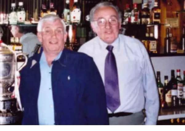 Jim, left, with the Sam Maguire Cup in Maguire's Bar, Portadown (2002) , when Armagh beat Kerry in the GAA All Ireland Senior Championship. On the right of the picture is Seamus McCaffery who is a well known Portadown man and long time barman of Maguires Bar.