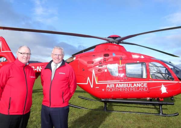 Pictured with the Airbus helicopter is Air Ambulance Northern Ireland (AANI) chairman Ian Crowe and trustee Ray Foran.

Picture by Jonathan Porter/Press Eye
