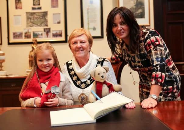 Mayor of Mid and East Antrim Borough Council, Cllr Audrey Wales MBE welcomes Bertie the Ballymena Bear to sign her guestbook in the Mayors Parlour. Also pictured is star of the advert, Rachel Stevenson and Alison Moore, BID Manager