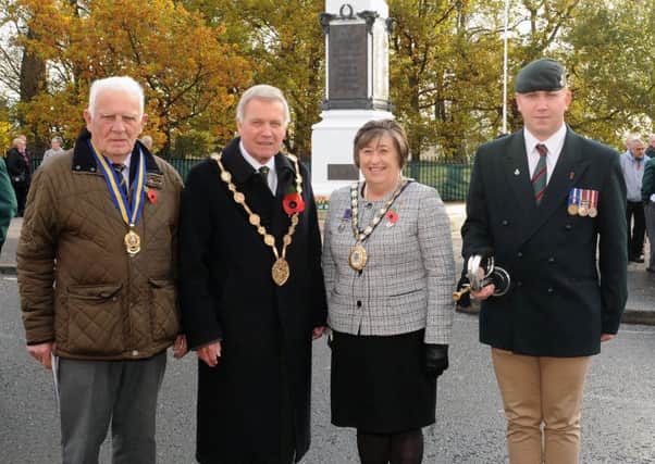 The Mayor and Mayoress of Lisburn & Castlereagh, Councillor Brian Bloomfield MBE and Mrs Rosalind Bloomfield, pictured with Gordon Rogan, Chairman of Lisburn Branch of the Royal British Legion (left) and bugler Cpl Jake Pugsley, 2nd Battalion, The Rifles (right) at the Armistice Day Ceremony at Lisburn War Memorial.